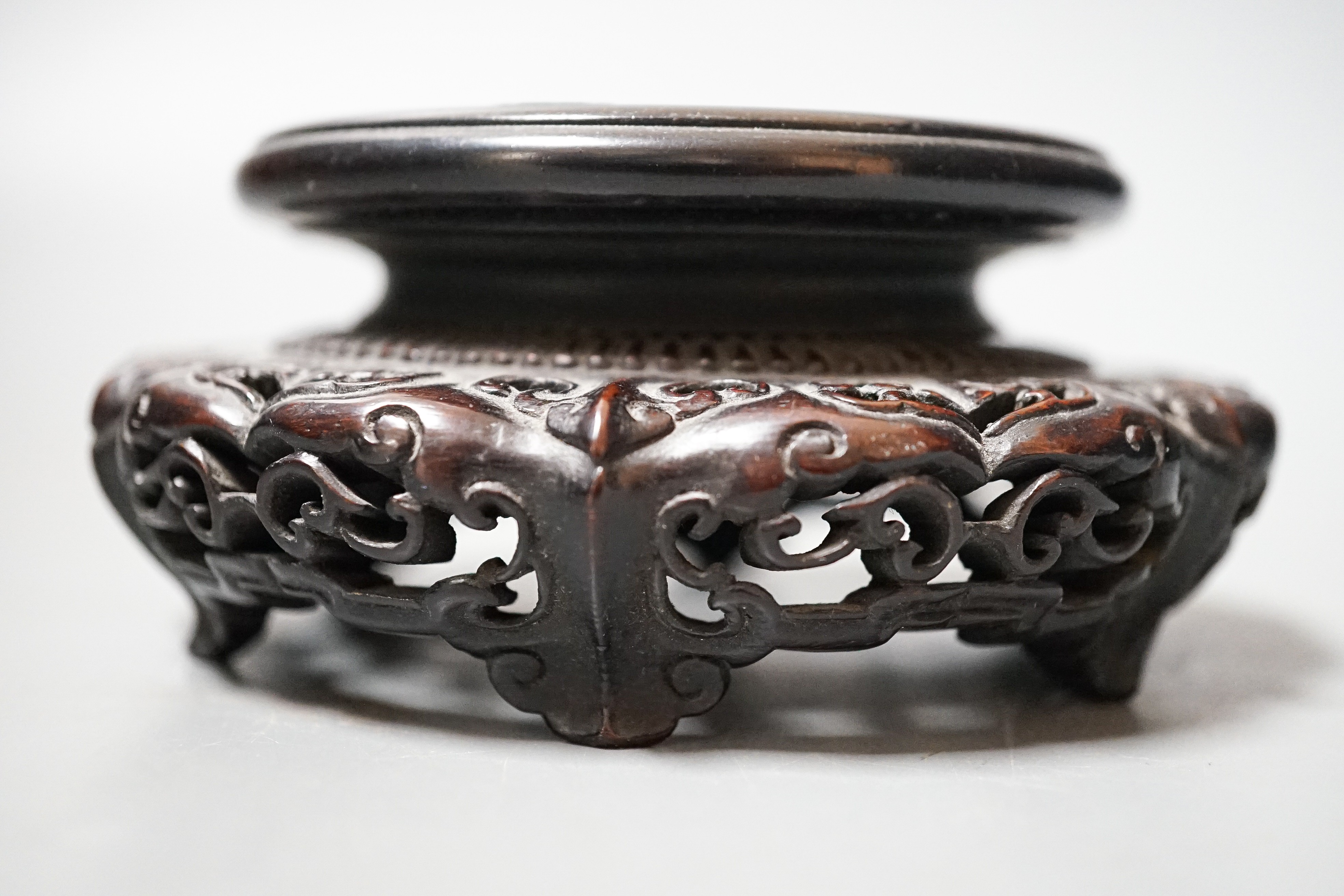 A fine 19th century Chinese hardwood stand, 11.4cm diameter